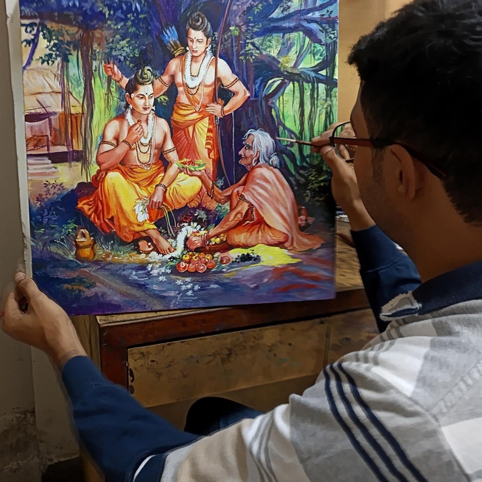 artist creating a hand-painted portrait from photograph by Kalakari