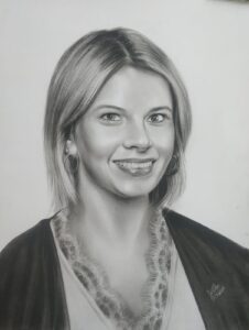 Handmade charcoal portrait drawing of a person created from a reference photo
